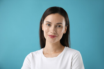 Portrait of beautiful woman on blue background
