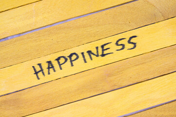 Wooden planks painted yellow with the word 