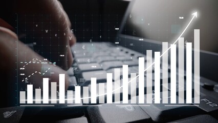 A close-up view of hands typing on a laptop keyboard, overlaid with a digital graph representing financial growth, showcasing business analytics and performance trends. Copula