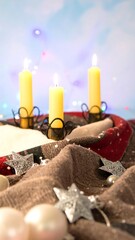 Warm Christmas candles on a textured cloth