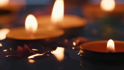 Candles floating in river water for Diwali festival