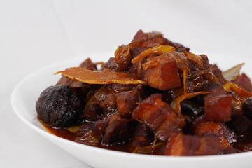 Asian style braised pork belly with mushrooms in savory sauce