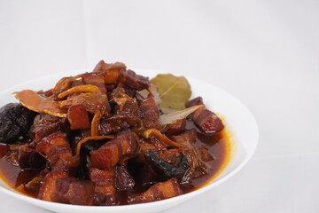 Traditional homemade pork belly stew with mushrooms