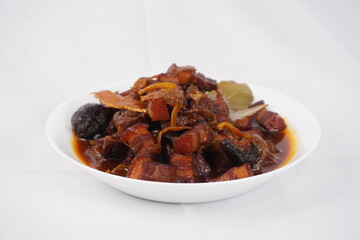 Gourmet pork belly cubes with mushrooms in rich sauce