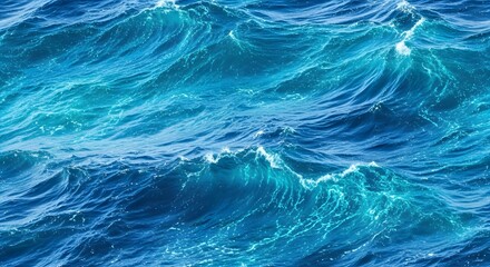Obraz premium An overhead shot of ocean waves showing various shades of blue and white foam on the water surface