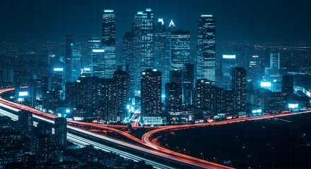 Obraz premium A sprawling city skyline at night with long exposure light trails from traffic on a busy highway. A modern urban metropolis with a cool blue tone.
