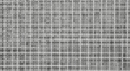 Fototapeta premium A uniformly textured gray background is composed of countless small square tiles arranged in a precise grid, creating a subtle geometric pattern.