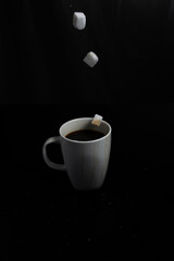 Sugar Cubes Falling into Coffee