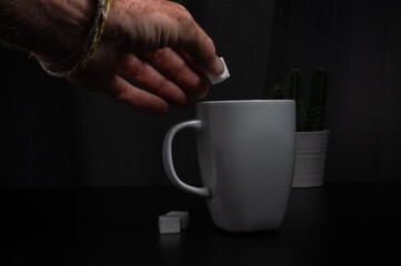 Adding Sugar to Coffee in a Minimalist Setting