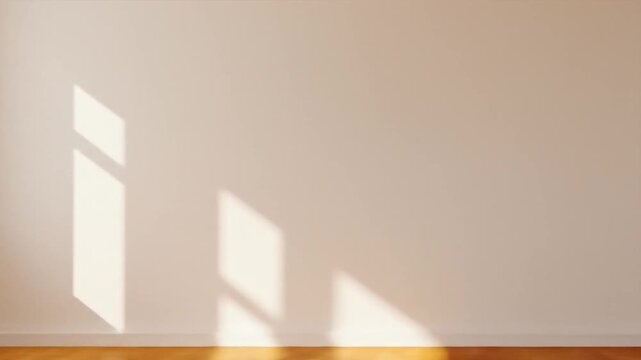 Bright, empty room with wooden floor and sunlight casting shadows, ideal for interior design concepts