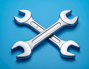 Crossed Chrome Wrenches on a Blue Background

