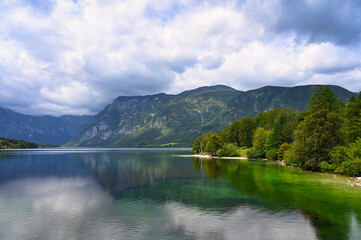 Bohinj Lake, Slovenia. Landscape of the lake with green water and mountains in background