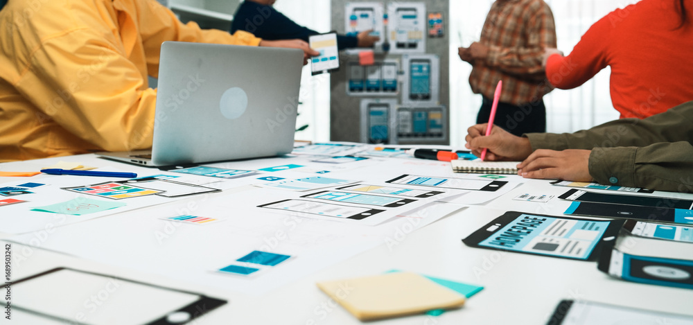 Poster a diverse group of professionals collaborates in a modern office, brainstorming and creating digital