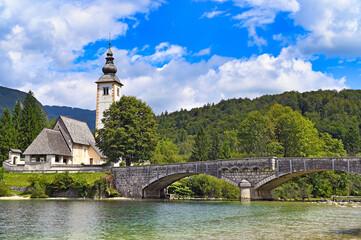 Old stone bridge and church,Ribcev Laz,Bohinj Lake landscape, Slovenia