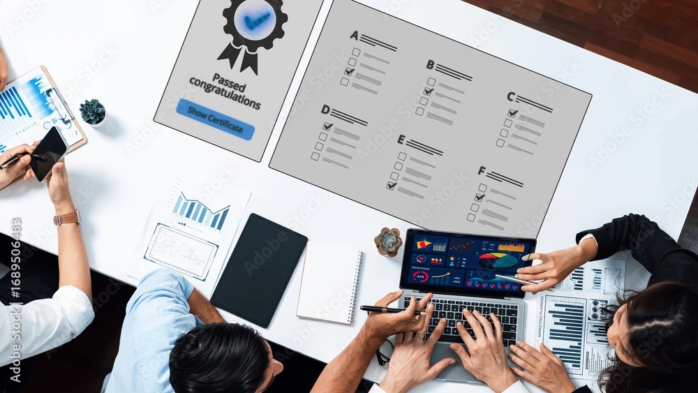Poster an aerial view captures a team gathered around a table, showcasing charts and graphs that symbolize 