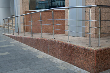Well designed accessible ramp with handrail for people with mobility challenges. This feature...