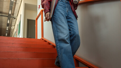 Person descending stairs in a building