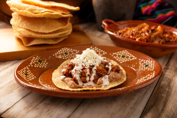 Ground beef tinga toast, a traditional Mexican home-cooked dish consisting primarily of beef cooked with chipotle chili and lots of onion, is traditionally eaten on 
