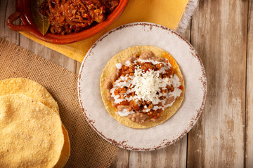 Ground beef tinga toast, a traditional Mexican home-cooked dish consisting primarily of beef cooked...
