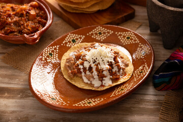 Ground beef tinga toast, a traditional Mexican home-cooked dish consisting primarily of beef cooked with chipotle chili and lots of onion, is traditionally eaten on 