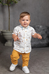 little boy on a gray background