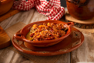 Ground beef tinga, a traditional Mexican home-cooked dish consisting primarily of beef cooked with chipotle chili and lots of onion, is traditionally eaten on 