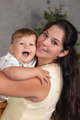 mother holding happy baby