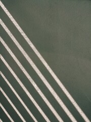 The background image of sunlight and shadows reflecting on the cement wall in diagonal lines...