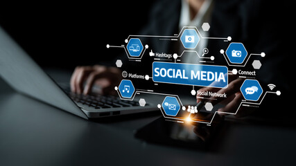 A person works on a laptop with smartphone while interacting with social media icons and concepts. The image captures the essence of digital communication and networking. Tessel