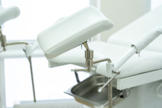 White gynecological chair in modern medical center - Powered by Adobe