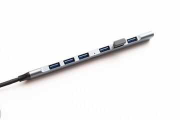 A modern compact USB hub displayed on a clean white background, perfect for showcasing connectivity and technology accessories in minimal style.