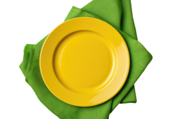 Empty yellow plate on a green napkin