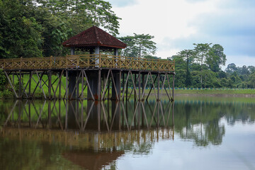 Wooden Lake Pavilion with Beautiful Reflection in Nature Landscape