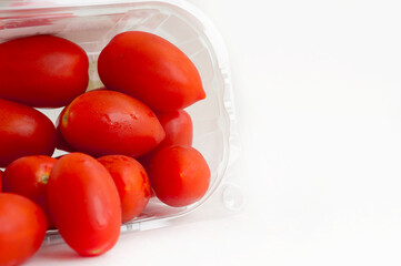 Fresh cherry tomatoes against white background. Raw vegetable.	
