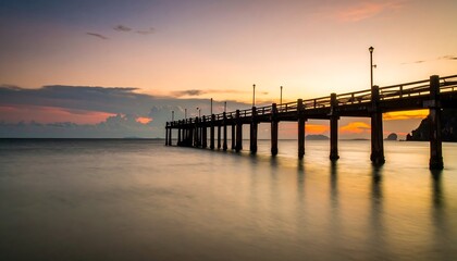 Fototapeta premium Sunrise over a wooden pier