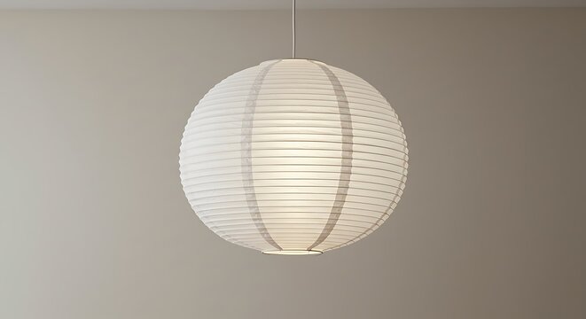 Round white paper lantern hanging from ceiling. - Powered by Adobe