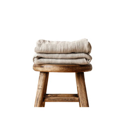 Stack of Beige Linen Fabric on Rustic Wooden Stool