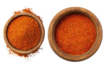 Two wooden bowls of vibrant orange spice blend