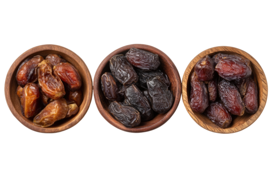 Three wooden bowls, each filled with dried dates, arranged horizontally.  The dates vary in shade, ranging from light brown to dark brown