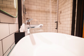 plumbing washbasin modern in hotel in bathroom on background shower