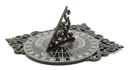 Ornate metal sundial with roman numerals and decorative flourishes against a white background