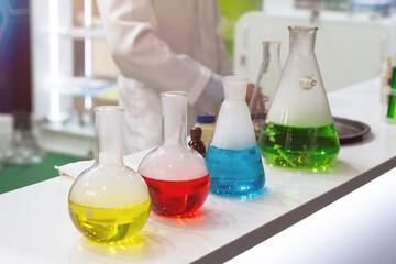 Laboratory tubes with liquids on the table.
