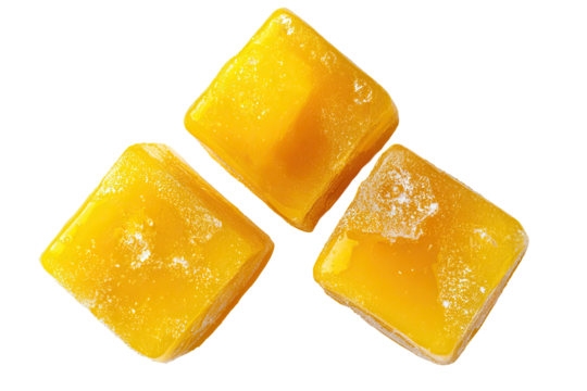 Three golden, diamond-shaped, frozen treats, arranged in a triangular pattern against a black background. The surface of each treat is textured with small, irregular crystals