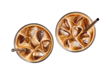 Two iced coffee drinks in clear glasses, seen from directly above.  Clear glasses filled with ice cubes and light brown coffee. Metal straws extend from each drink
