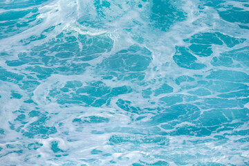 Sea surface aerial view. Background shot of clear sea water surface. Blue sea water in calm. Sea texture. Background blue waves of the ocean