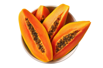 Fresh papaya slices in a shallow bowl.  Bright orange-yellow flesh, dark seeds visible.  Top-down view