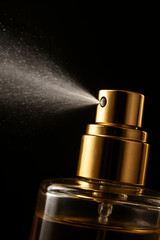 Perfume spray nozzle with mist in dark background
