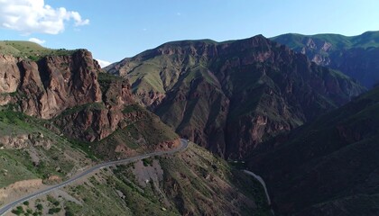 Naklejka premium Mountainous road winding through a deep canyon