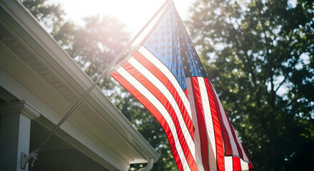 US flag hanging at entrance of house veranda, viewed from low angle