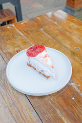 Indulge in a delightful slice of strawberry cheesecake, perfect for dessert menus and promoting sweet treats